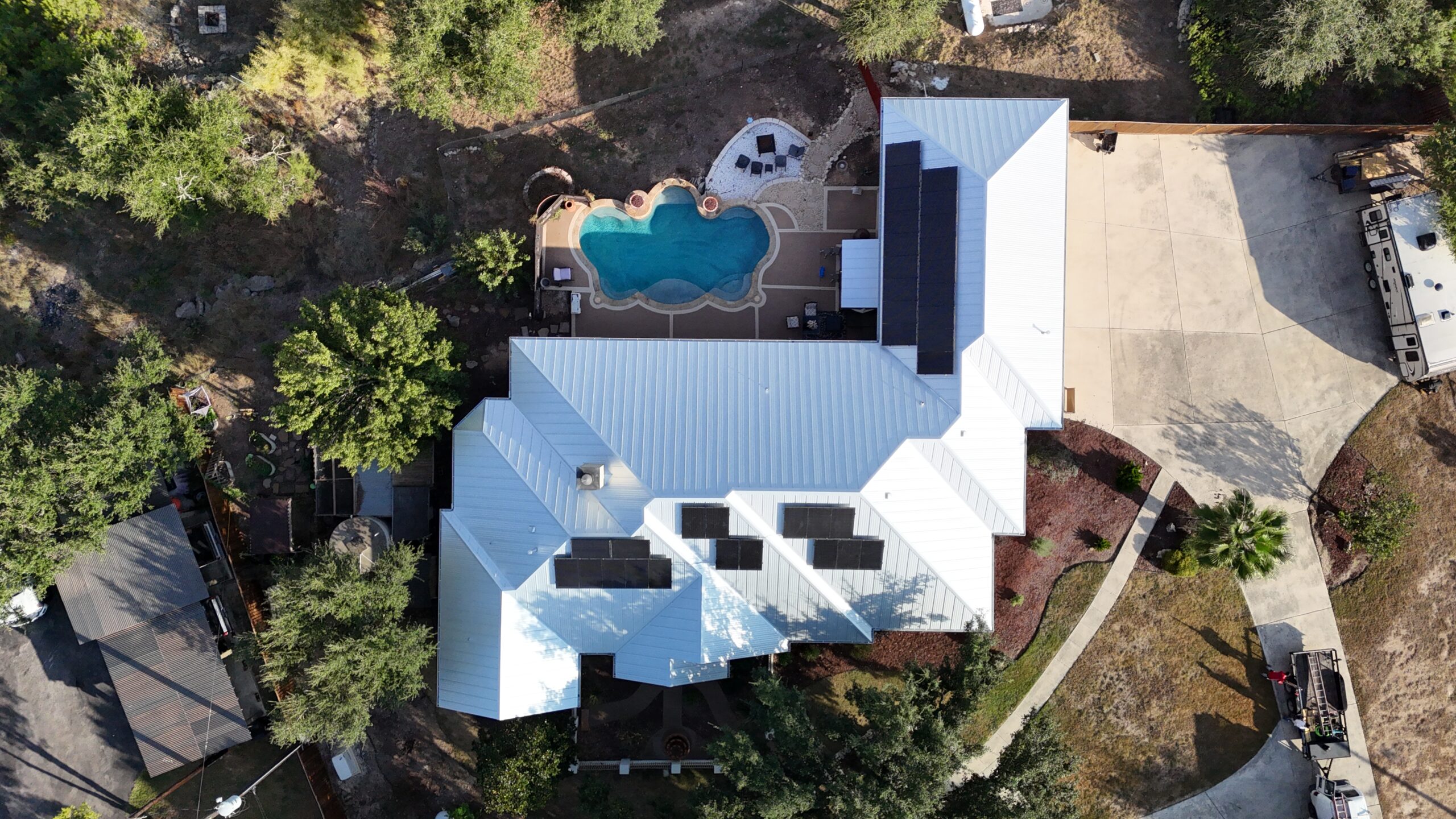 Standing seam metal roof replacement with solar panel installation in Creekwood Ranches in Spring Branch